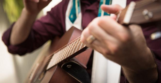 Cantor playing guitar