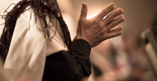 Hands clasped together in prayer